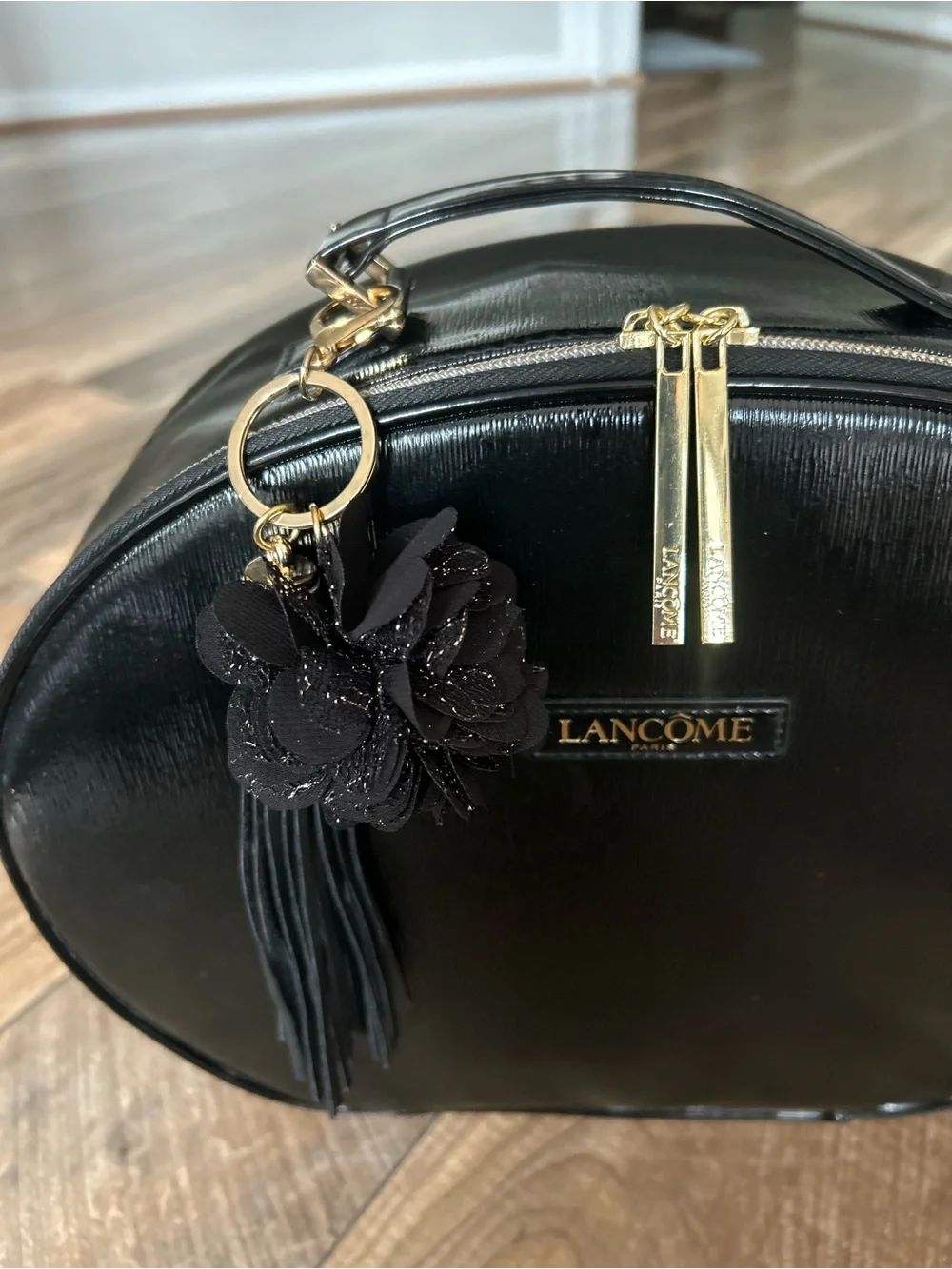 Lancôme Le Parisian Black Faux Leather Train Case Bag with Floral Tassel Charm
